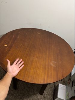 Large wooden table with foldable sides