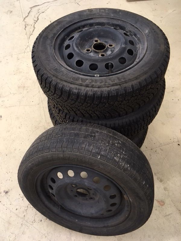1997 Toyota Corolla rims with minimal wear Studded Snow Tires.