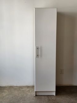 Tall white storage cabinet