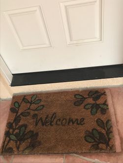 “Welcome” door mat