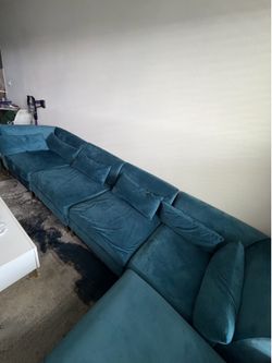 5-piece navy blue modular sectional with ottoman and gold hardware