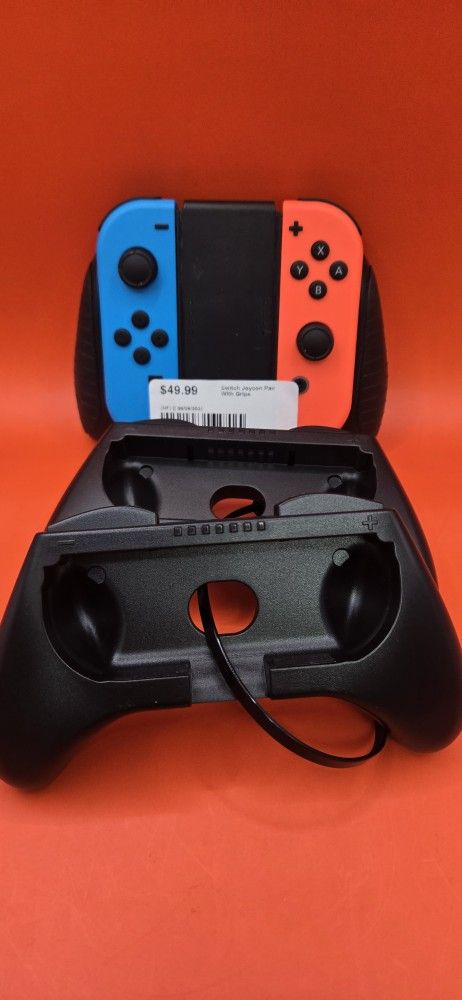NINTENDO SWITCH JOYCON PAIR W/ ACCESSORIES 