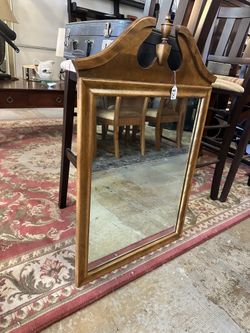 Wooden Mirror with Decorative Top.