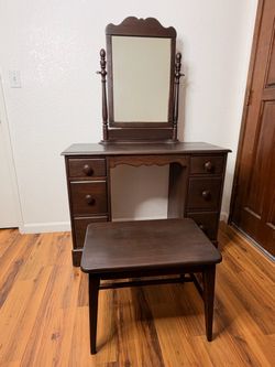 vintage or antique wooden vanity desk with an attached swivel mirror and a matching stool, 1940’s