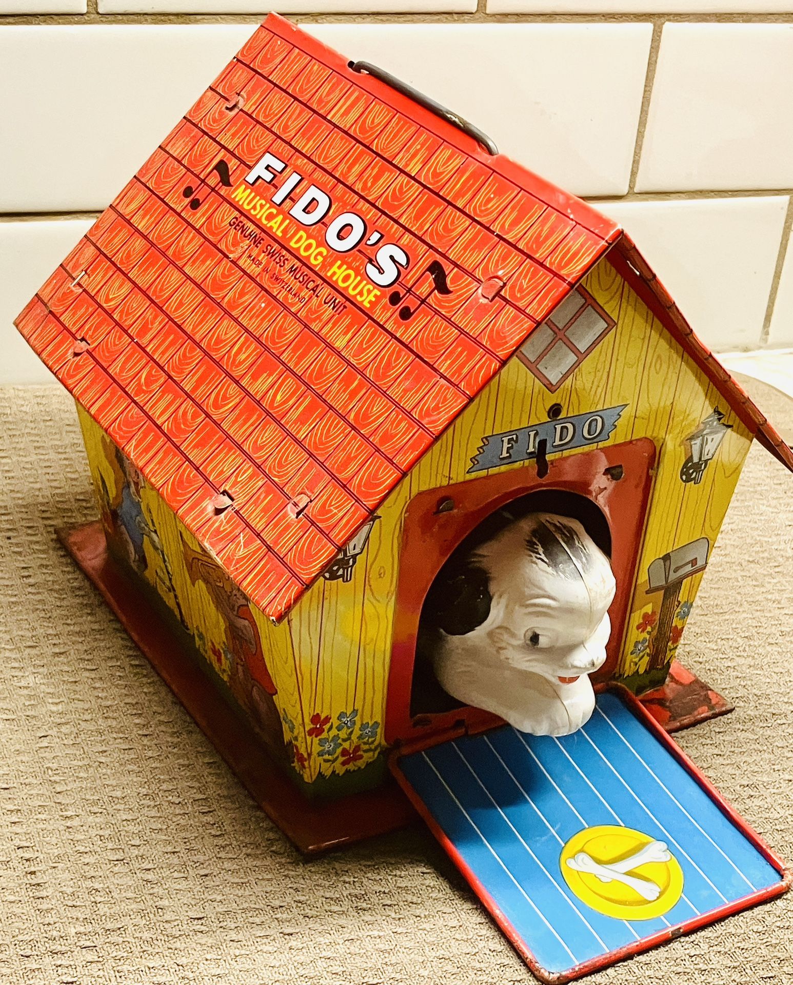 1960’s Fidos dog house .. tin wind-up toy