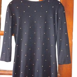 Black dress with gold beads.