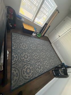 Blue and beige medallion area rug