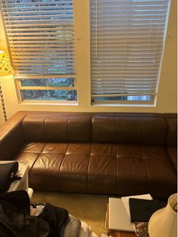 Selling brown leather sectional sofa
