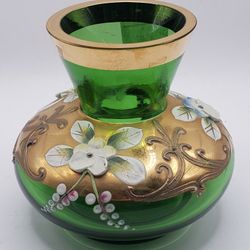 A vintage emerald green glass vase