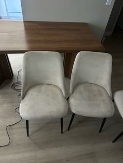 4 beige dining chairs