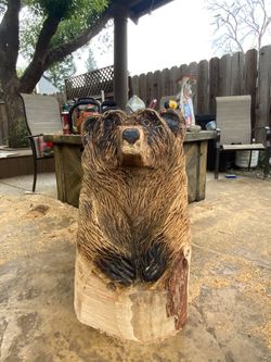 Bear in a log carving