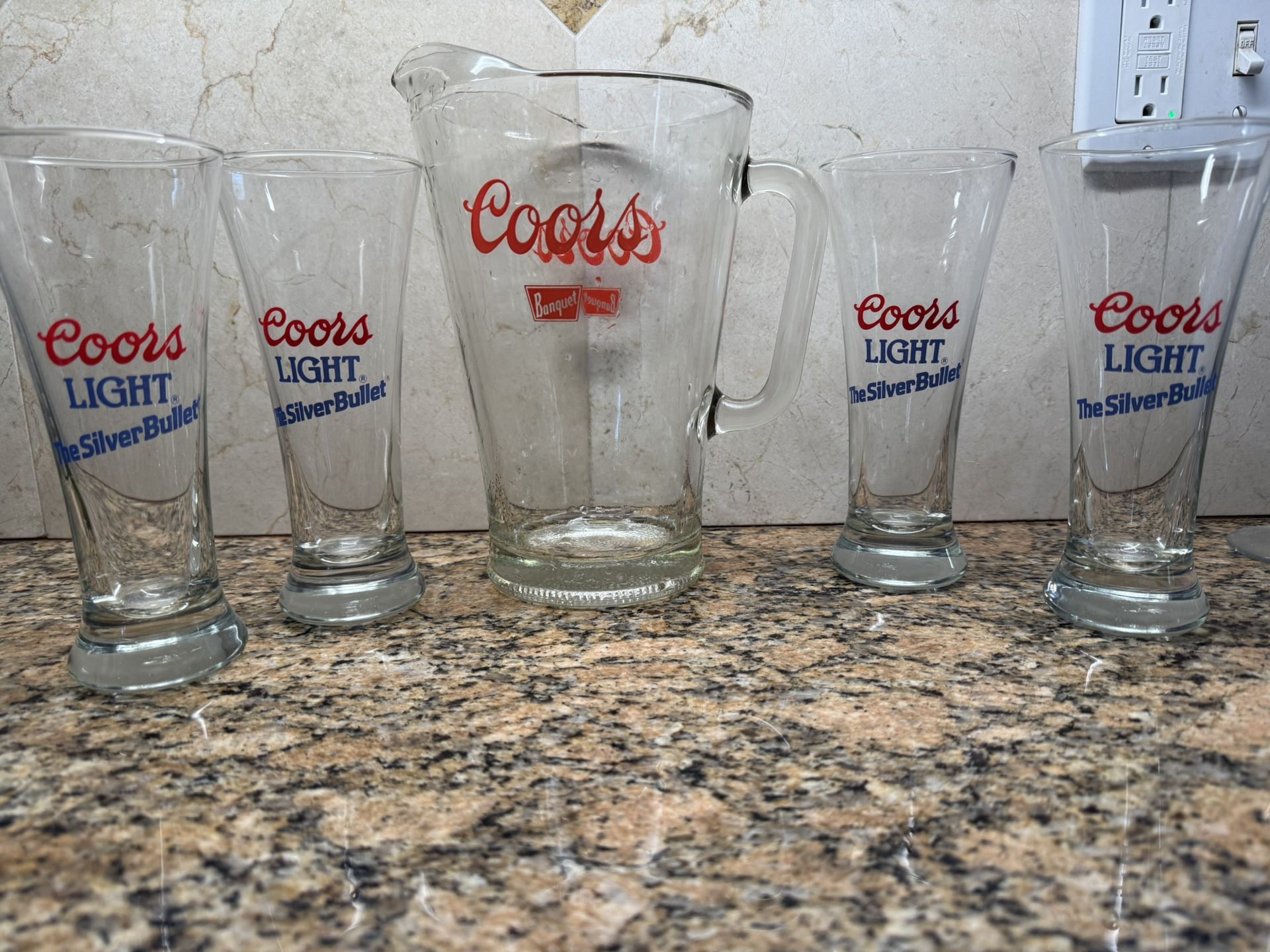 Glass Coors Set which includes a pitcher and four glasses.