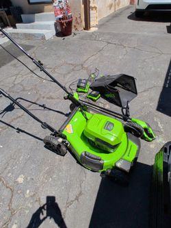 Greenworks 21" lawnmower, weed whacker, and batteries