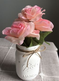 Distressed mason jar vase with silk flowers