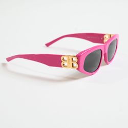 Sunglasses with a gold logo. Brand new. 