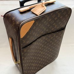 Louis Vuitton Monogram Pegase 55 rolling suitcase.