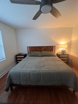 King size bed with mattress and night stands