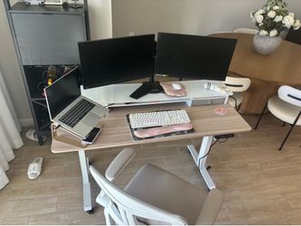 Standing desk and rolling chair