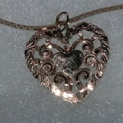14 Karat Gold Chain And Heart Pendant