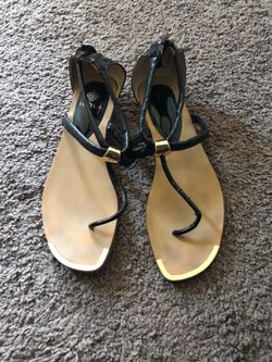 Black leather and gold sandals