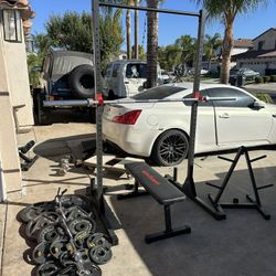 Bench press/squat rack with 7ft 45lbs bar plus 280lbs of Olympic weights and curl bar plus weights tree