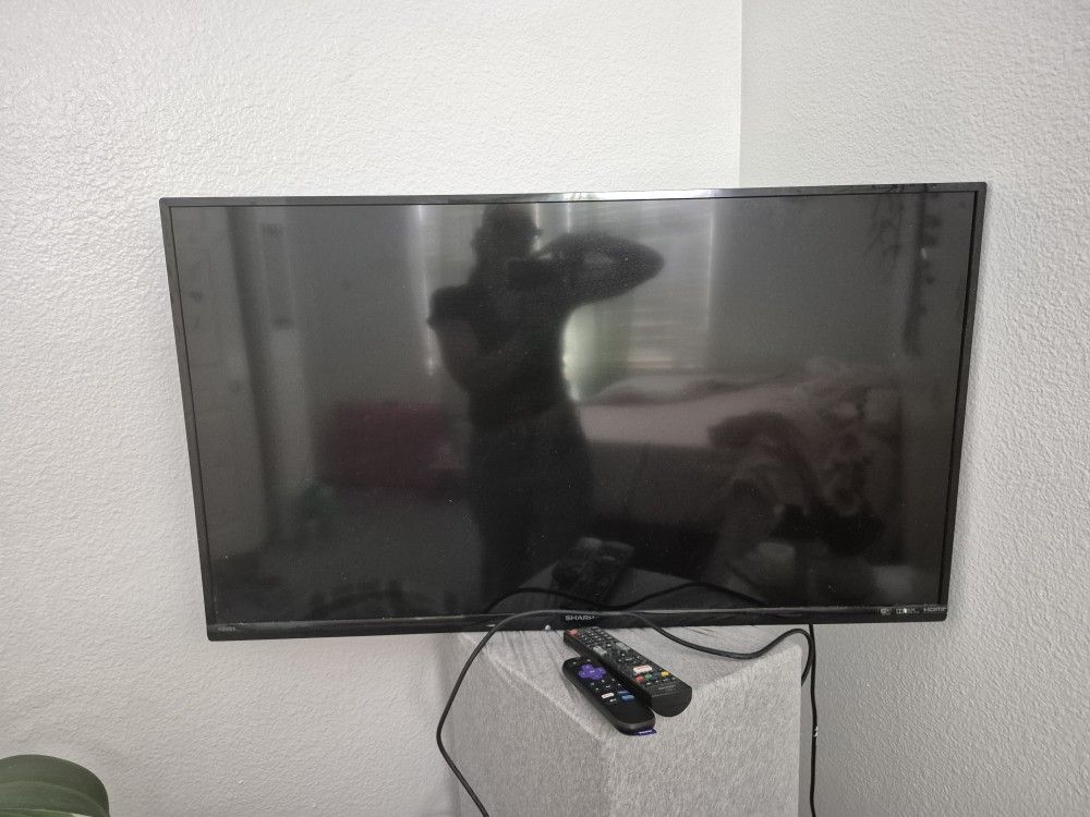 Roku STREAMING stick...and SHARP Aquios Tv....works Great !!!round Remote And Sharp REMOTE