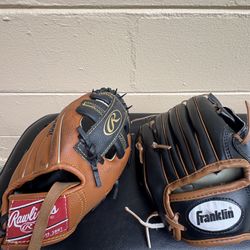 2 kids baseball gloves