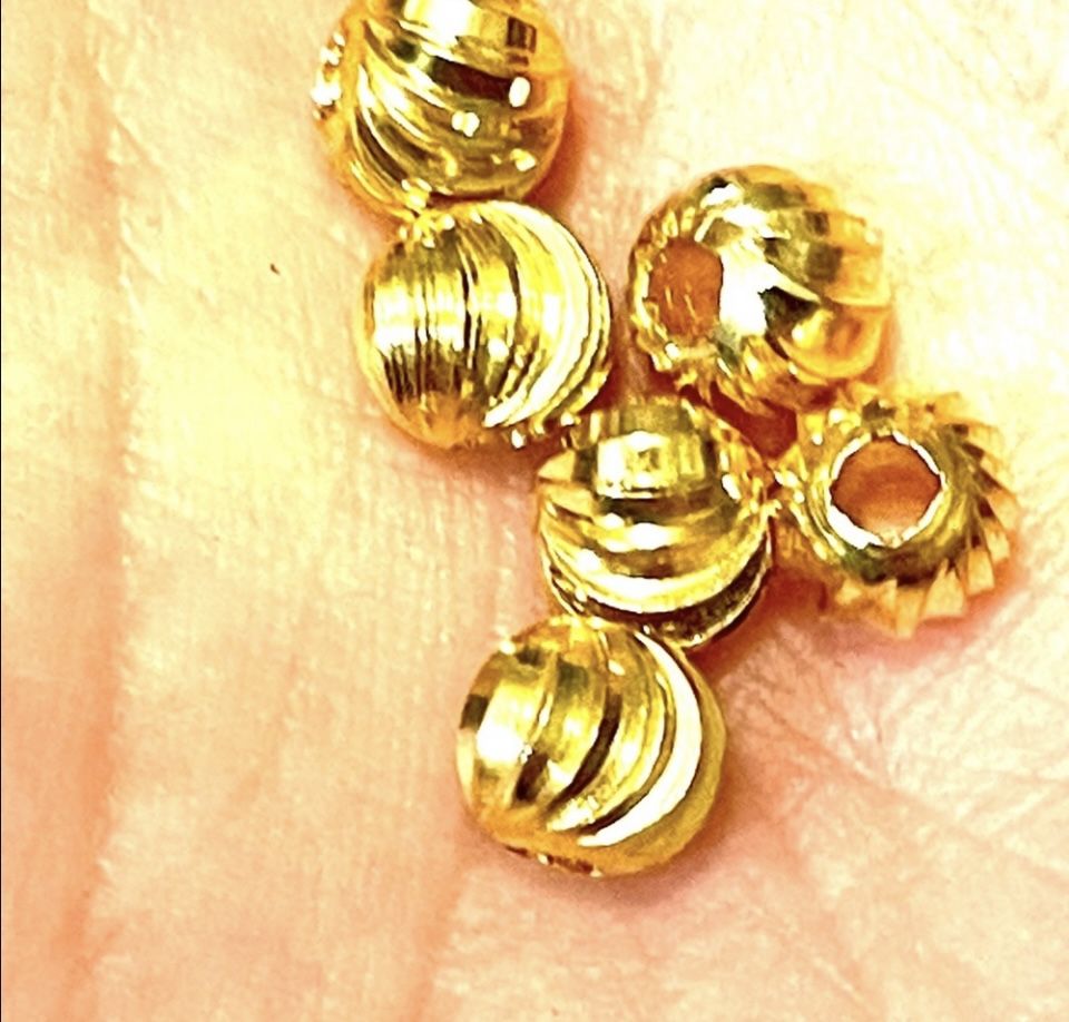 Gold Tone Swirl Beads