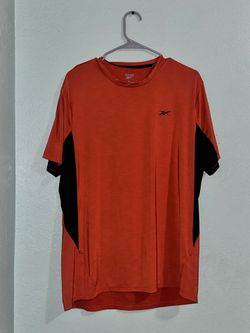 Orange Reebok athletic shirt