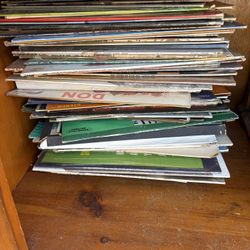 A Vinyl Record Player And Vinyl Records For Sale