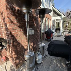 Two Propane Heaters With Propane Tanks Plus an Extra Tank