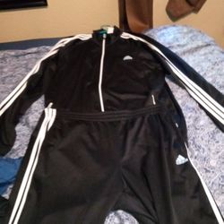 UNISEX ADIDAS TRACK SUIT. WORN ONLY ONCE. IN EXCELLENT CONDITION.
