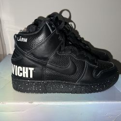 Nike Dunk High 1985 Undercover Black (“Chaos / Gleichgewicht” pair — German text edition)