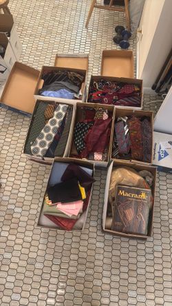 Craft supplies including over 100 neckties .