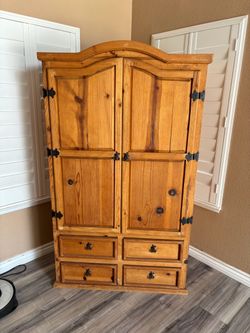 wooden armoire cabinet.