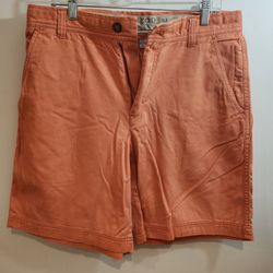 Izod mens Flat Front Slant Pocket salmon colored shorts size 34