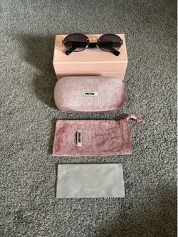 Miu Miu Rounded Women’s Sunglasses