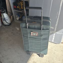 Free  suitcase green w/wheels