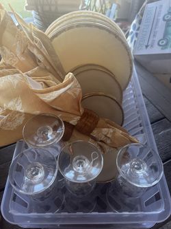 Vintage plate set with glasses, napkins, and napkin holders