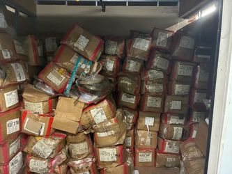 Women’s belt in bulk! Storage unit full of boxes.