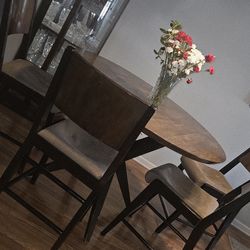 Sectional sofa, Dining table with 4 chairs, and Marlowe corner curio.