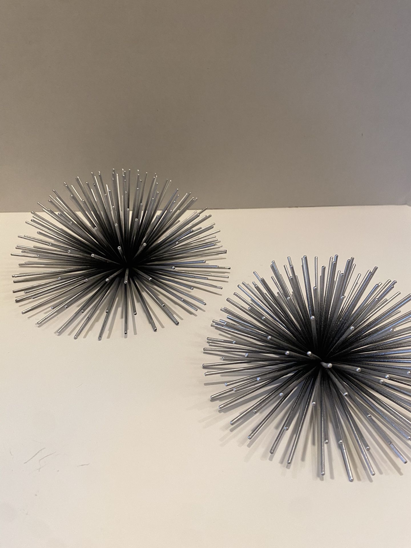 MCM metal Sea Urchin sunburst silver & black wall hangings. Set of two. 6.5 inch & 5.5 inches.