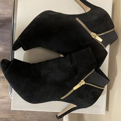 Marc Fisher Black suede booties with a peep toe and gold zippers.  Size 8.5w