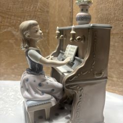 retired Lladró porcelain figurine titled "Practice Makes Perfect" (model number 5462).