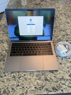 MacBook Pro, iPhone 8 Plus and Apple Watch SE 40mm