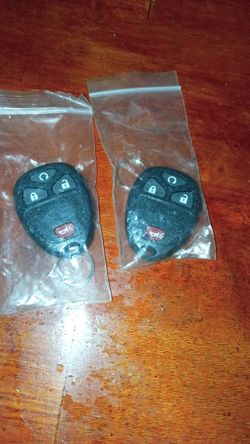 Pair of GM-style keyless entry remote key fobs (untested/as-is)