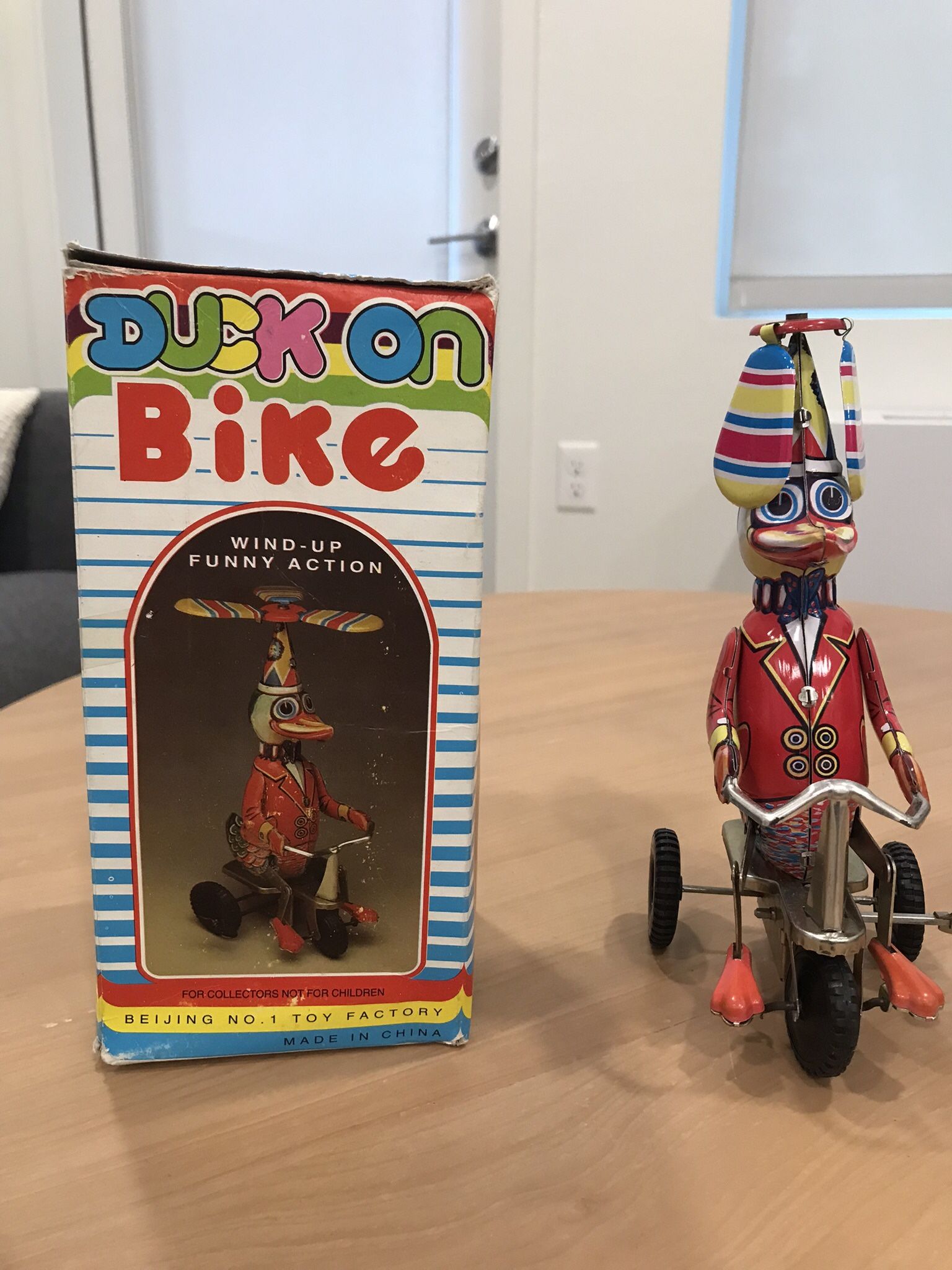 Vintage Wind Up Toy Duck On Bike