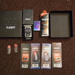 Two Zippo Lighters With Extras 