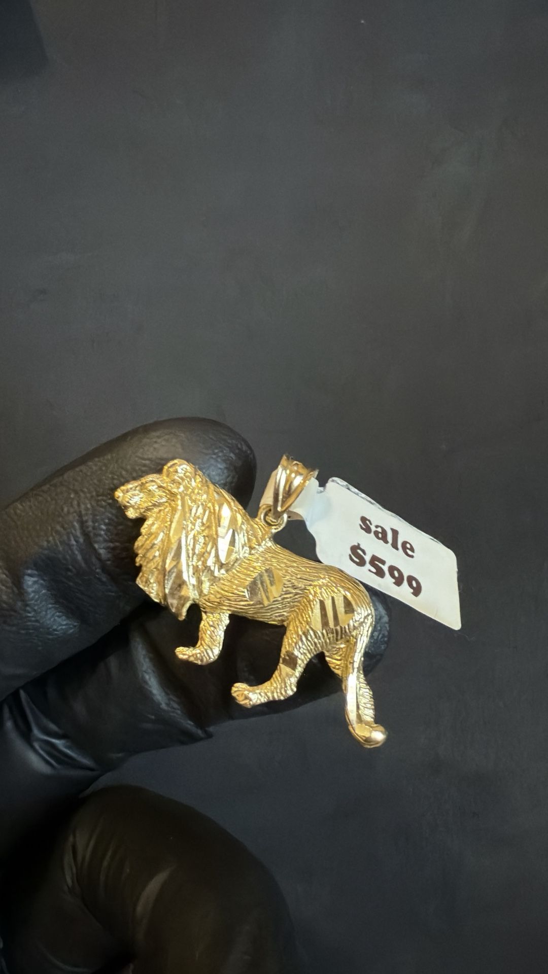 Gold lion pendant