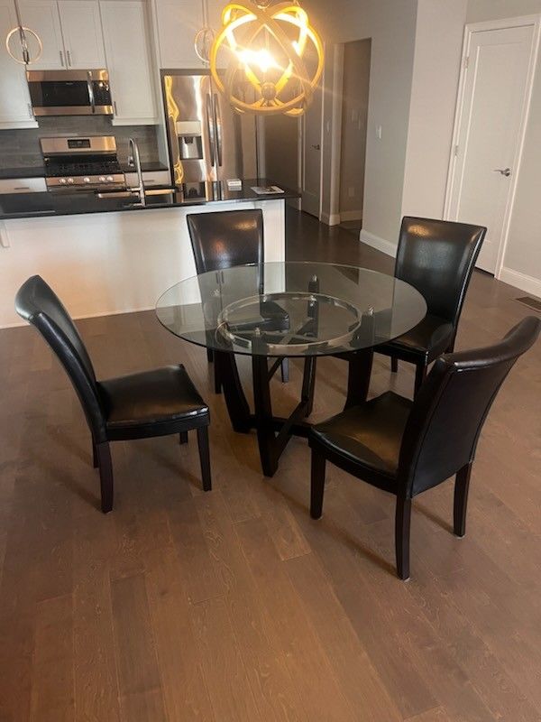 Glass Top Table With 4 Black Leather Chairs